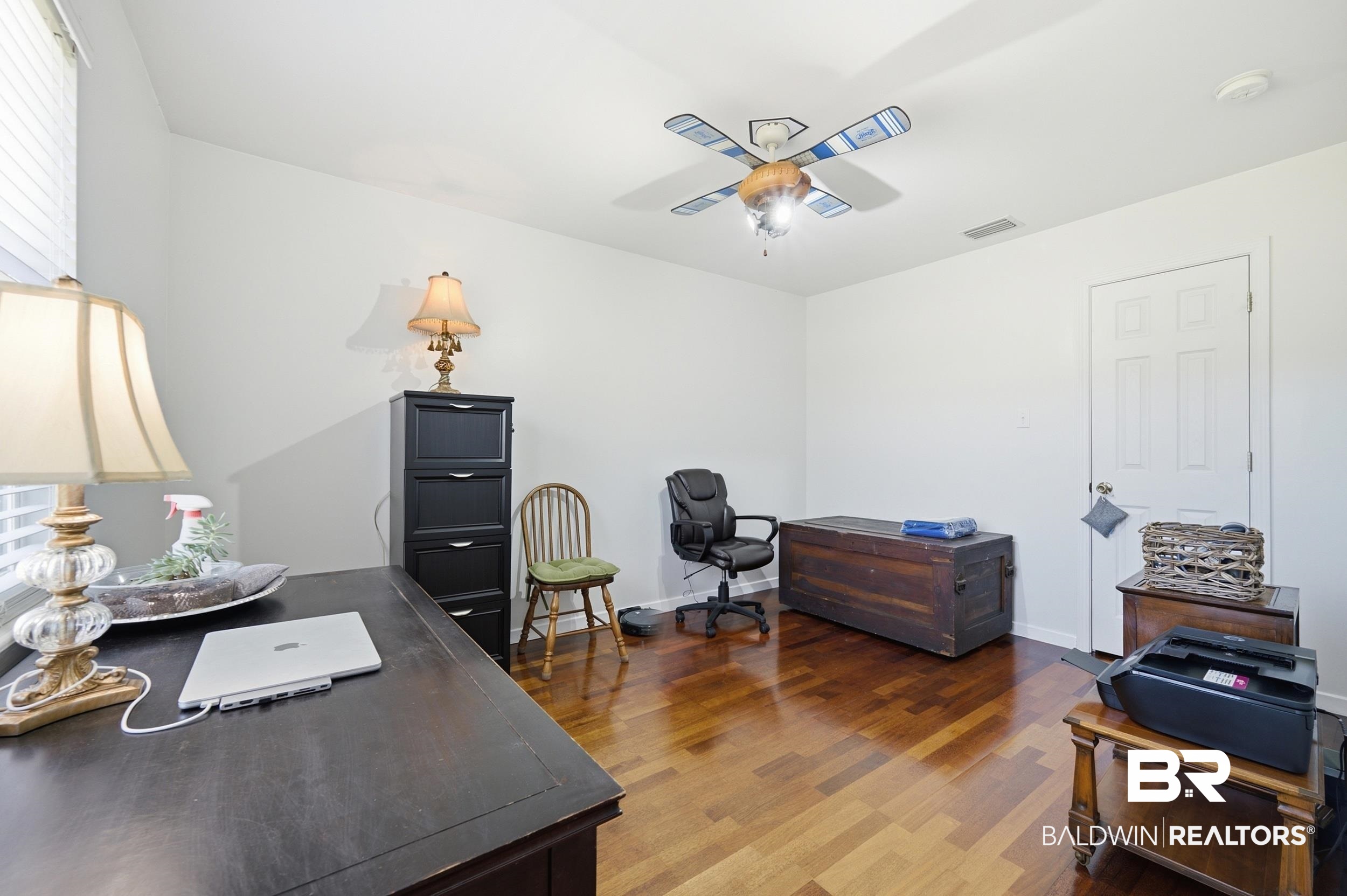 15855 Calvin Richerson Road Bay Minette, AL 36507 - Photo 53 of 83 White walls complement wood-finish flooring in this versatile room