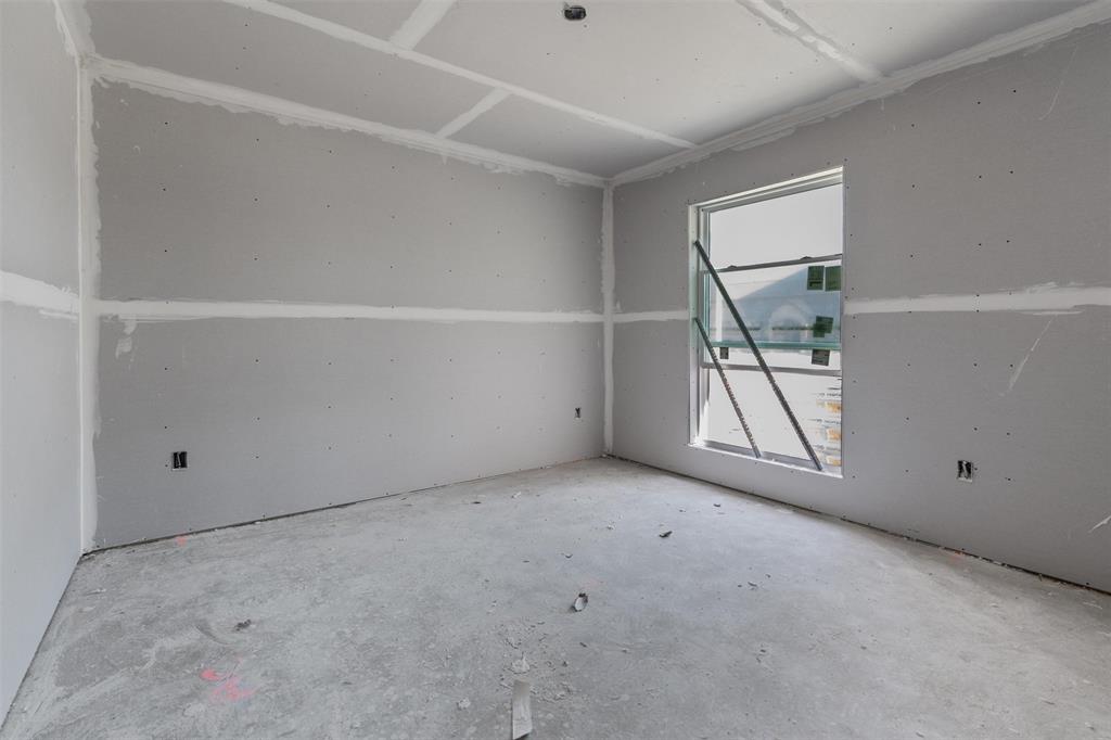 1405 Red Rock Road Hewitt, TX 76643 - Photo 8 of 20 Unfinished interior space with drywall installation, exposed concrete flooring, and a single pane window