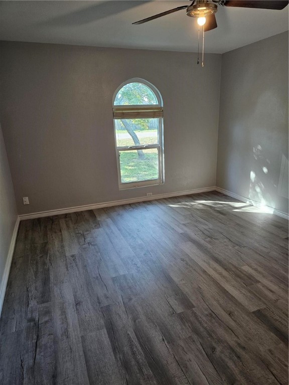 2313 Retta Drive Corpus Christi, TX 78418 - Photo 13 of 23 an empty room with wooden floor chandelier fan and windows