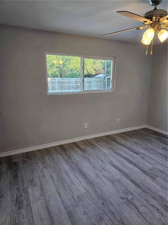 2313 Retta Drive Corpus Christi, TX 78418 - Photo 9 of 23 a view of an empty room with wooden floor and a window