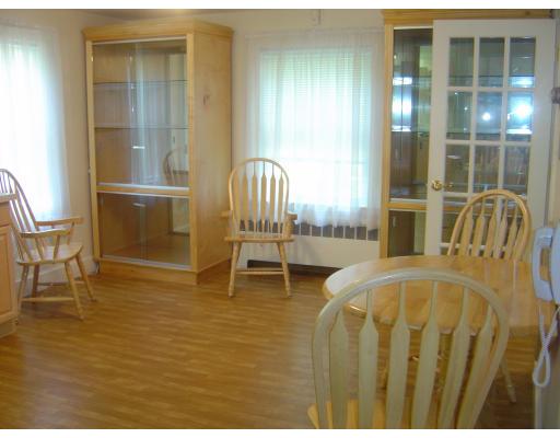12 Drumlin Road Marblehead, MA 01945 - Photo 5 of 8 a bedroom with a bed and glass door