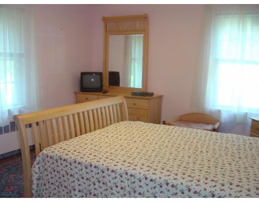 12 Drumlin Road Marblehead, MA 01945 - Photo 8 of 8 a bedroom with a bed and wooden floor
