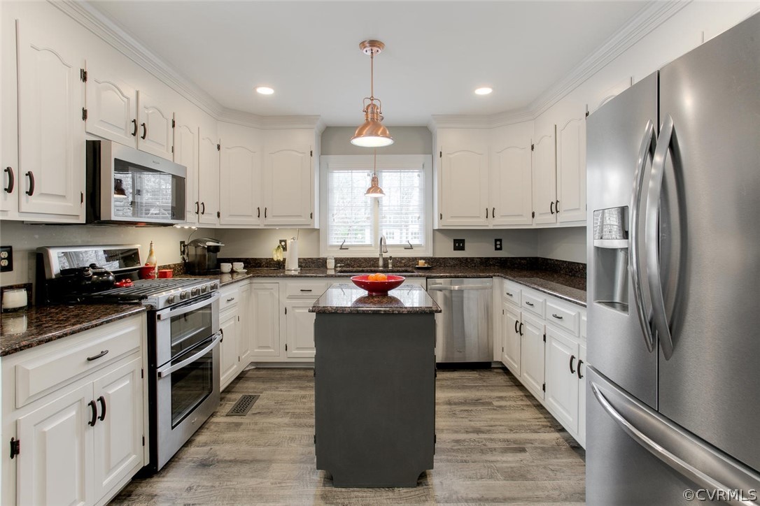 403 Rivers Bend Court Chester, VA 23836 - Photo 13 of 39 a kitchen with kitchen island granite countertop lots of white stainless steel appliances