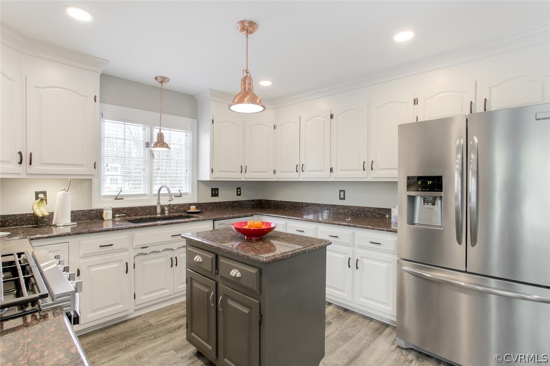 403 Rivers Bend Court Chester, VA 23836 - Photo 16 of 39 a kitchen with white cabinets and white appliances