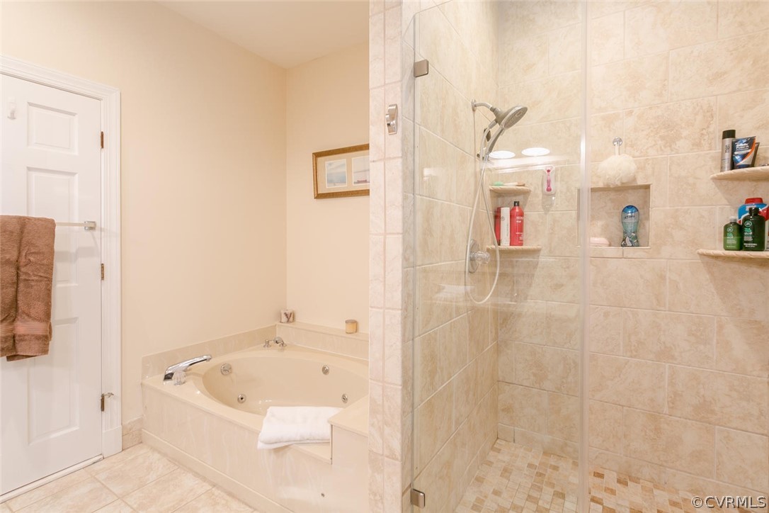 403 Rivers Bend Court Chester, VA 23836 - Photo 23 of 39 a bathroom with a bathtub and shower