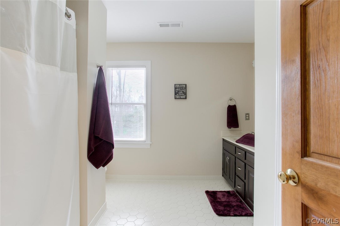 403 Rivers Bend Court Chester, VA 23836 - Photo 25 of 39 a bathroom with a bathtub and shower