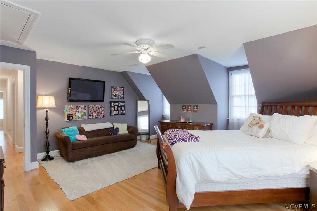 403 Rivers Bend Court Chester, VA 23836 - Photo 29 of 39 a bedroom with a bed a couch and a flat screen tv