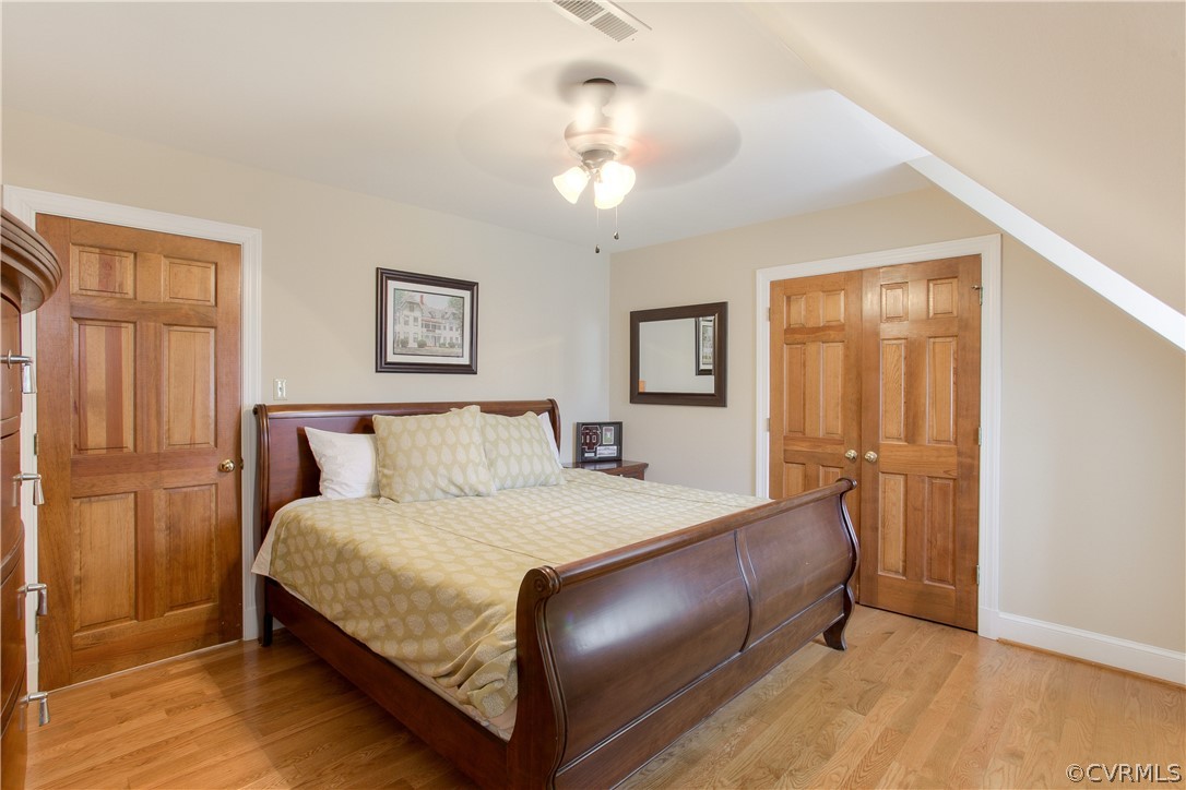 403 Rivers Bend Court Chester, VA 23836 - Photo 33 of 39 a bedroom with a bed and a chandelier