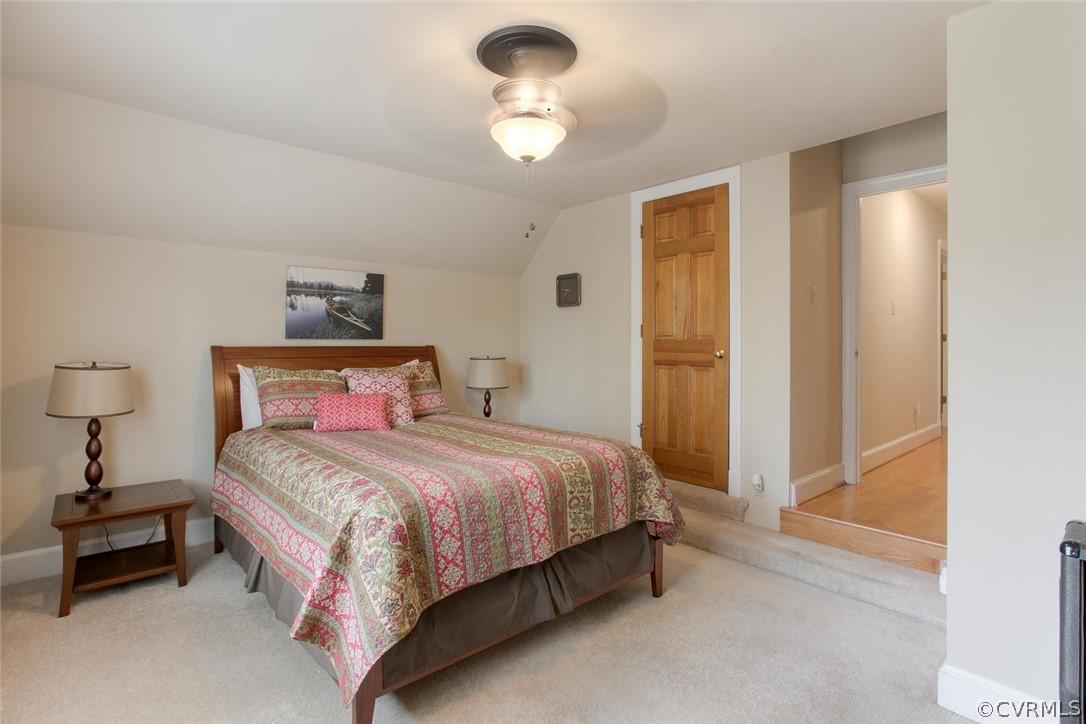 403 Rivers Bend Court Chester, VA 23836 - Photo 35 of 39 a bedroom with a bed and a chandelier