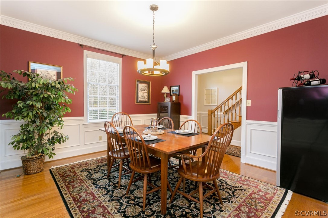 403 Rivers Bend Court Chester, VA 23836 - Photo 7 of 39 a dining room with furniture window and wooden floor