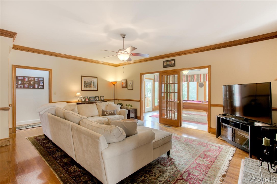 403 Rivers Bend Court Chester, VA 23836 - Photo 10 of 39 a living room with furniture and a flat screen tv