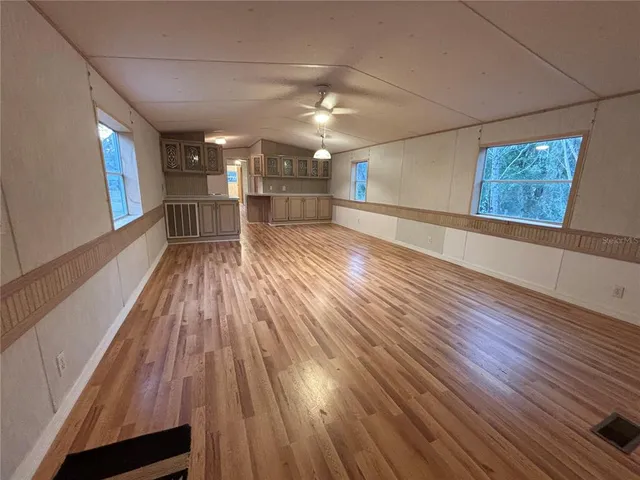 a view of gallery with wooden floor