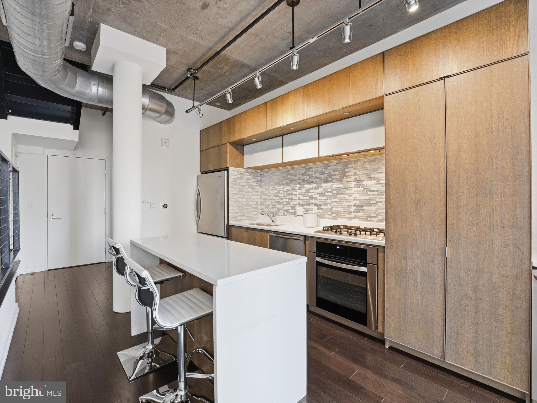 1515 15th Street Northwest, Unit 401 Washington, DC 20005 - Photo 4 of 37 Gourmet Kitchen with Custom Cabinetry