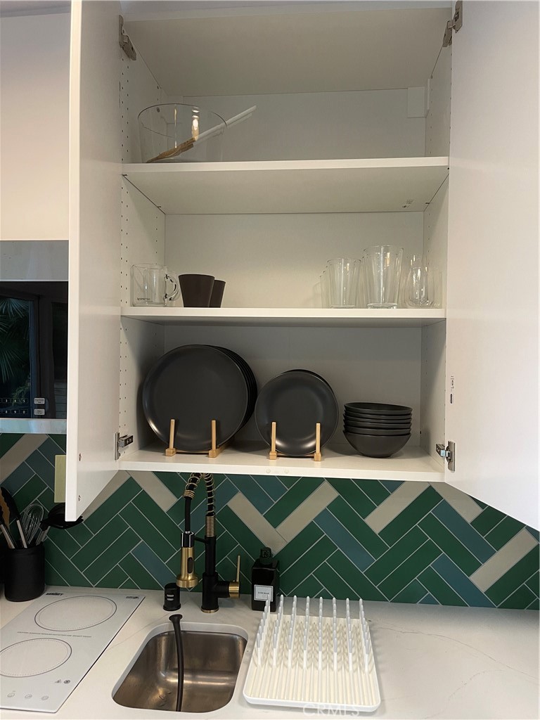 736 Griffith Place Laguna Beach, CA 92651 - Photo 11 of 31 a kitchen with a sink and cabinets