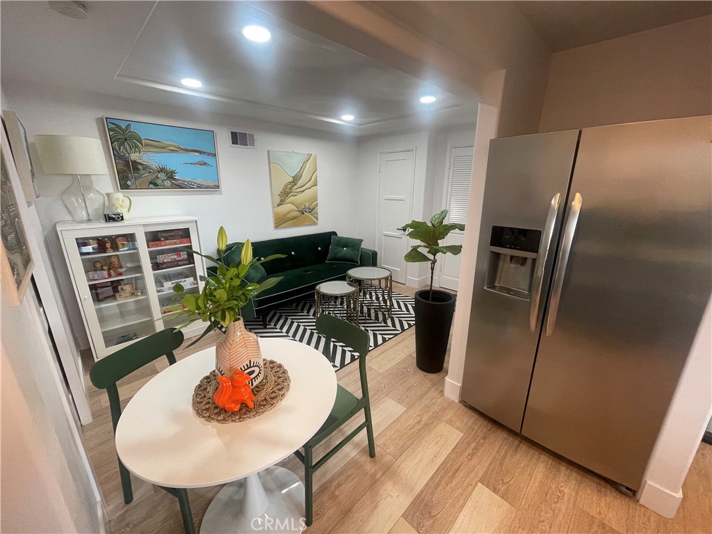 736 Griffith Place Laguna Beach, CA 92651 - Photo 12 of 31 a dining room with furniture and wooden floor