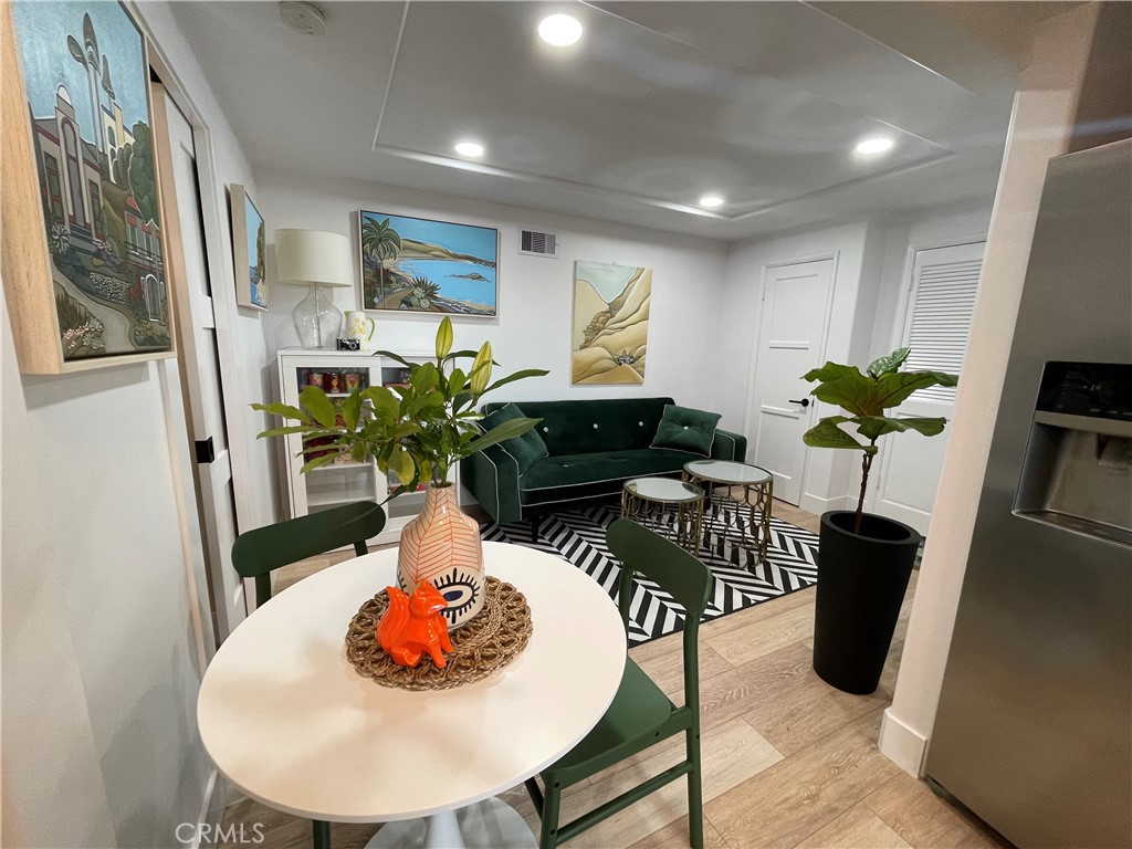 736 Griffith Place Laguna Beach, CA 92651 - Photo 13 of 31 a dining room with furniture and wooden floor