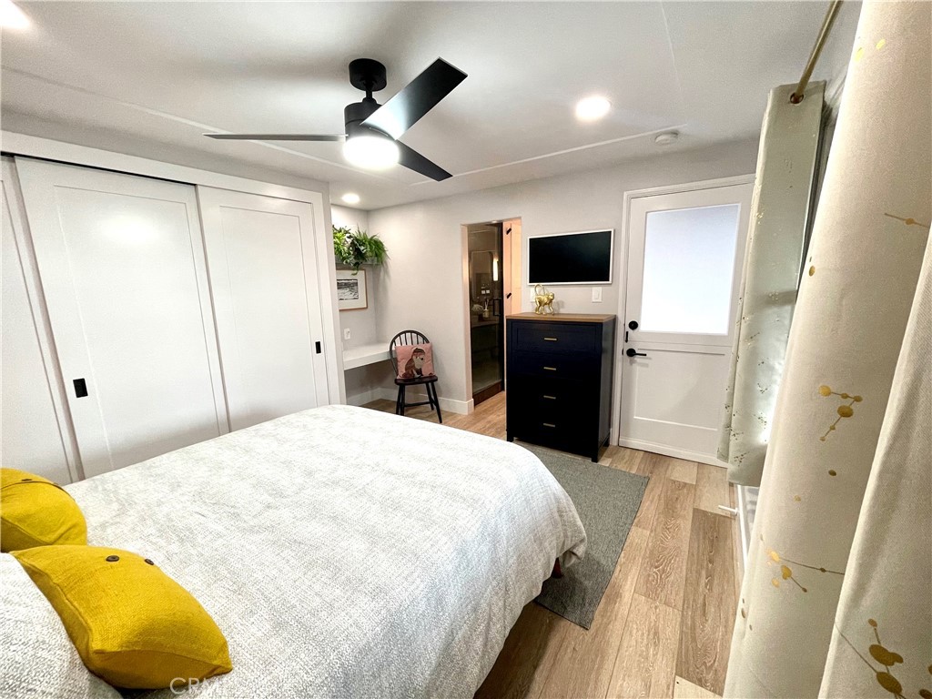 736 Griffith Place Laguna Beach, CA 92651 - Photo 17 of 31 a bedroom with a bed and a flat tv screen