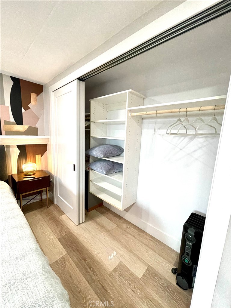 736 Griffith Place Laguna Beach, CA 92651 - Photo 29 of 31 a room with a bed and a mirror