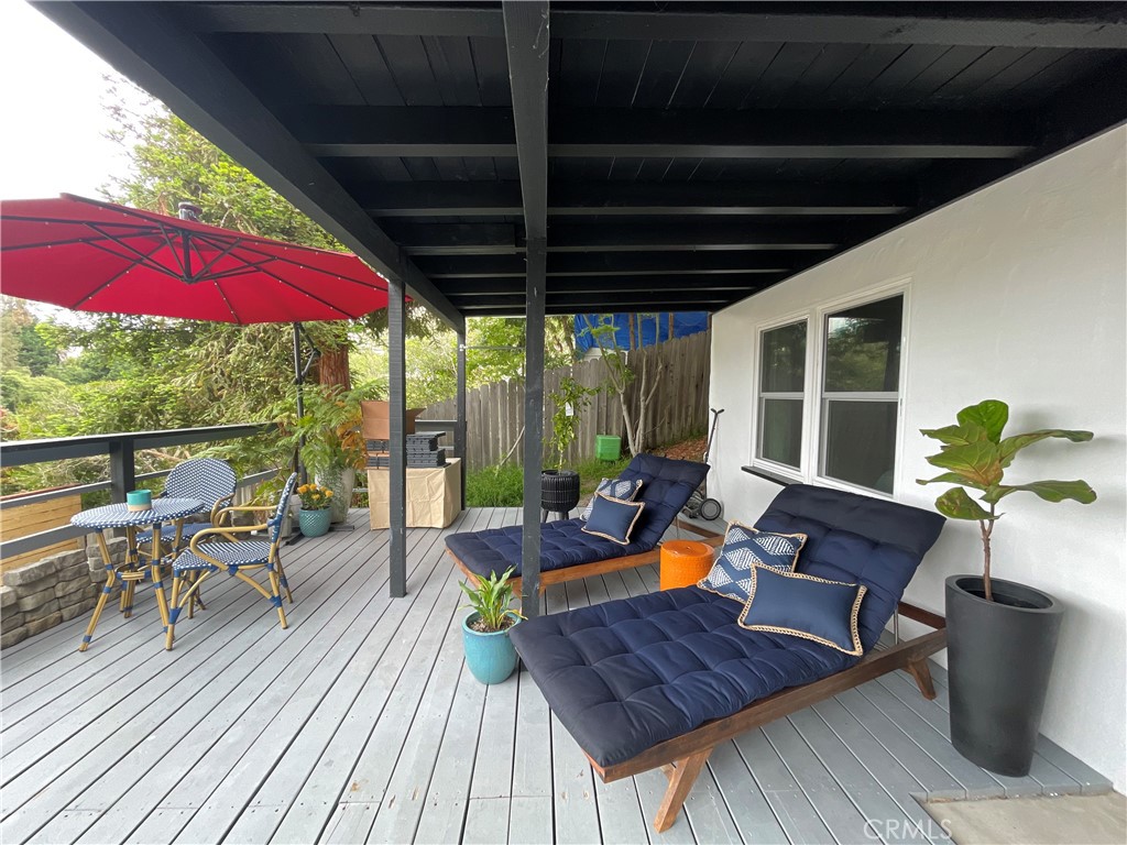736 Griffith Place Laguna Beach, CA 92651 - Photo 7 of 31 a view of a deck with chairs and wooden floor