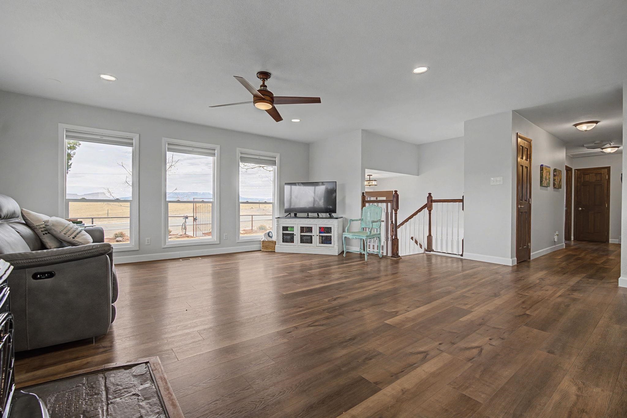 847 26 Road Grand Junction, CO 81505 - Photo 5 of 41 a living room with furniture and a wooden floor
