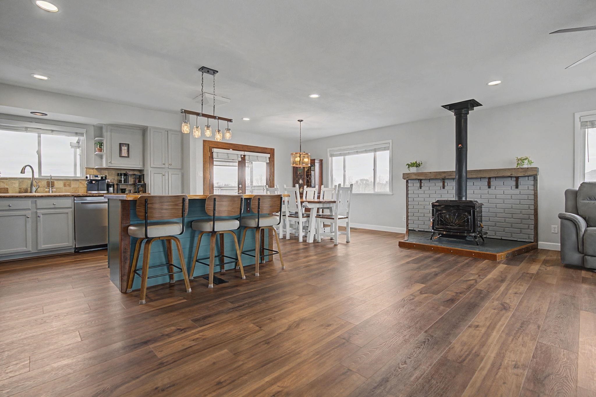 847 26 Road Grand Junction, CO 81505 - Photo 7 of 41 a living room with furniture a fireplace and wooden floor
