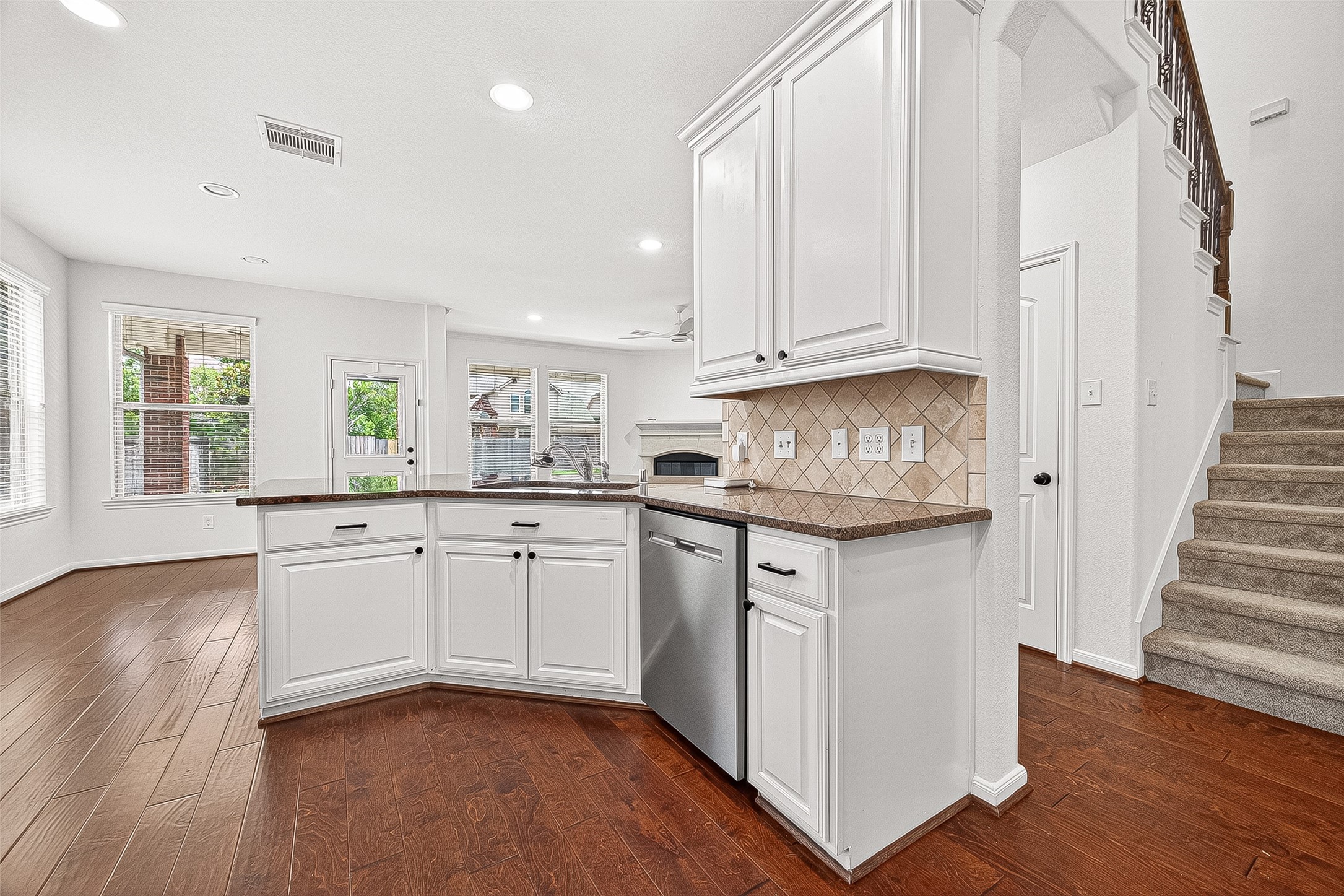 138 South Sawbridge Circle Spring, TX 77389 - Photo 16 of 37 a kitchen with granite countertop white cabinets and white appliances