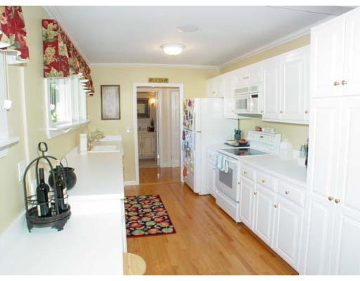 84 Rattlesnake Hill Road Andover, MA 01810 - Photo 6 of 16 a kitchen with stainless steel appliances kitchen island granite countertop a refrigerator and a sink