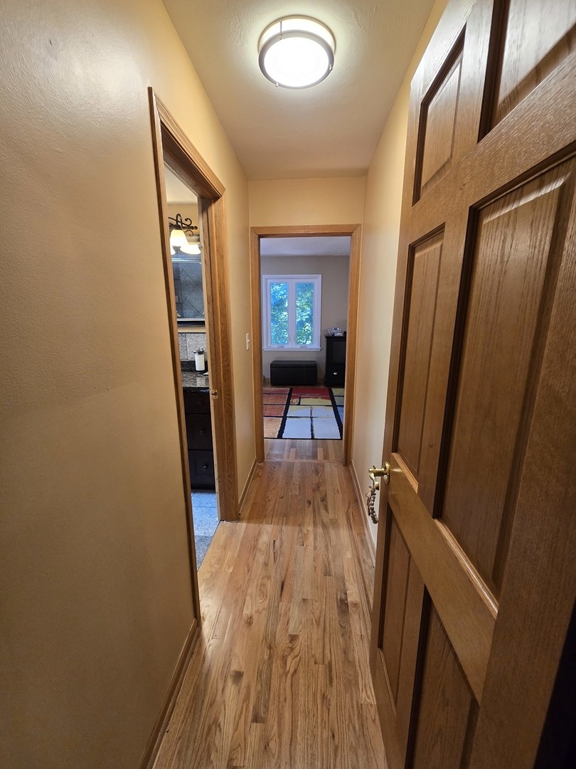 25W201 Summit Drive Naperville, IL 60563 - Photo 15 of 40 a view of a hallway and wooden floor