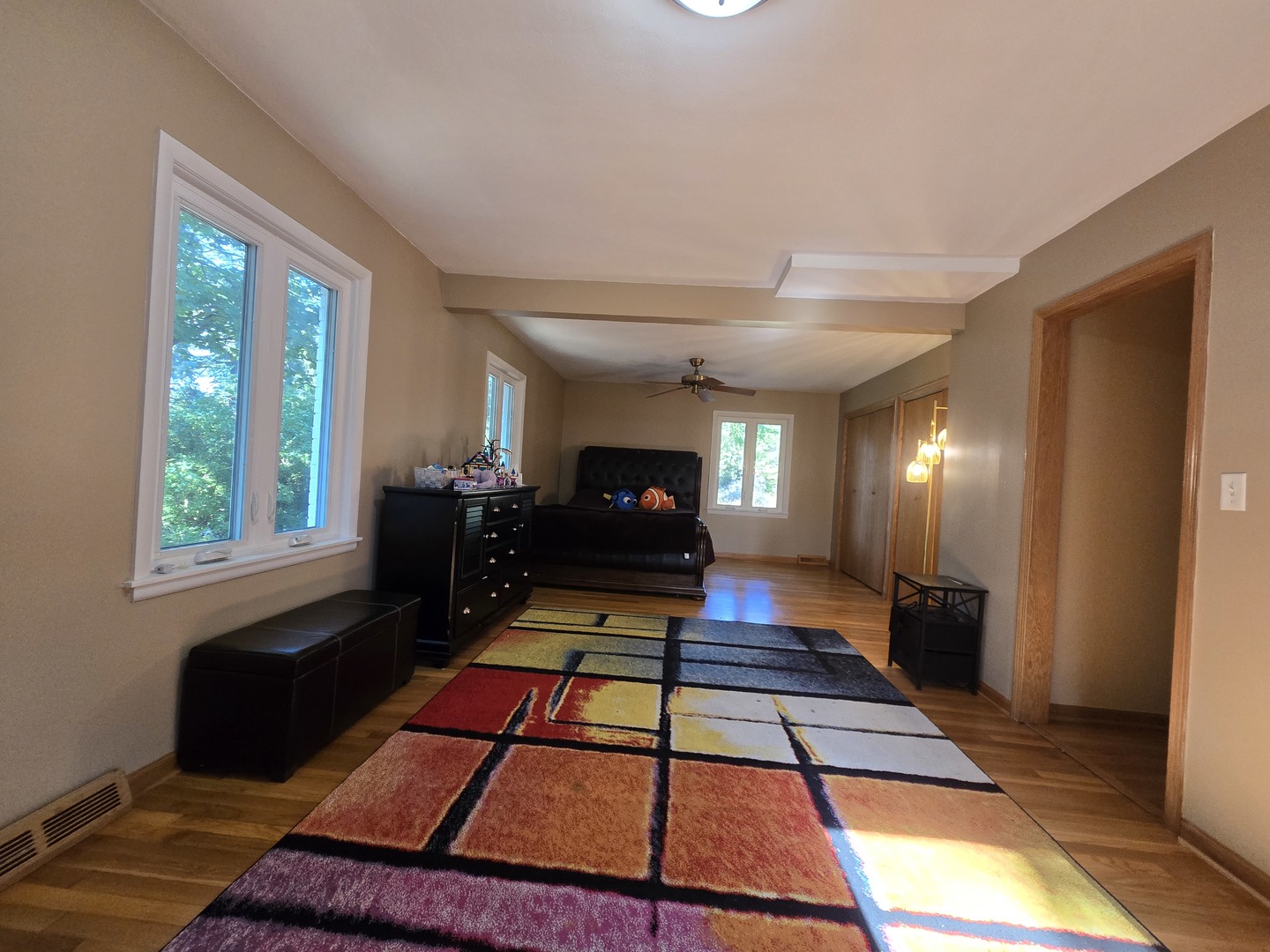 25W201 Summit Drive Naperville, IL 60563 - Photo 16 of 40 a living room with furniture a rug and a table