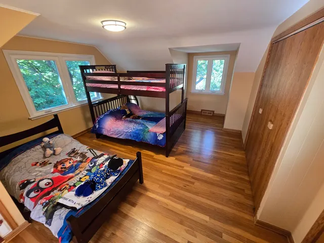 a bed room with furniture and a window