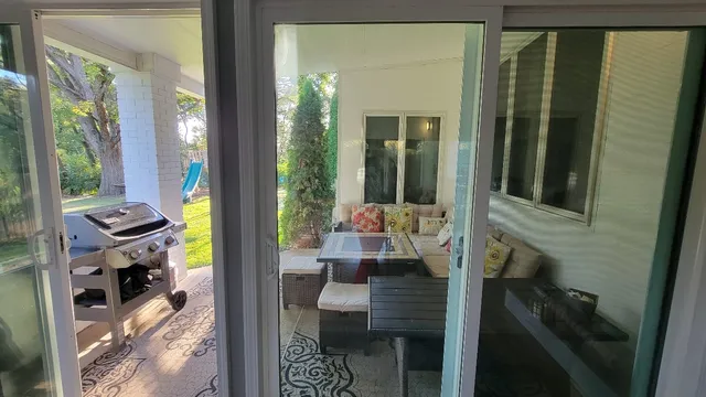 a balcony with table and chairs