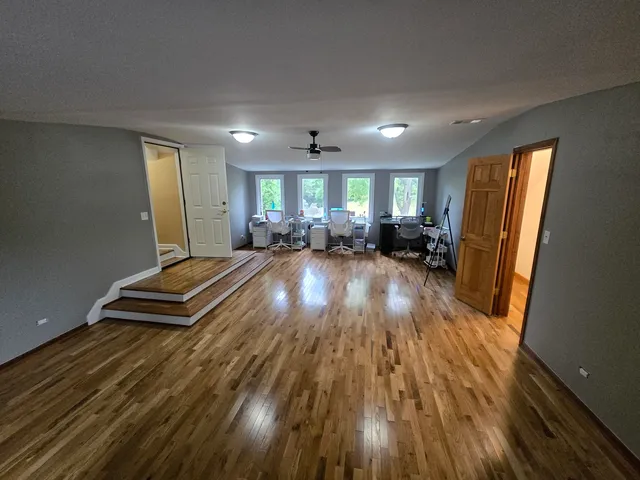 a view of an entryway with wooden floor