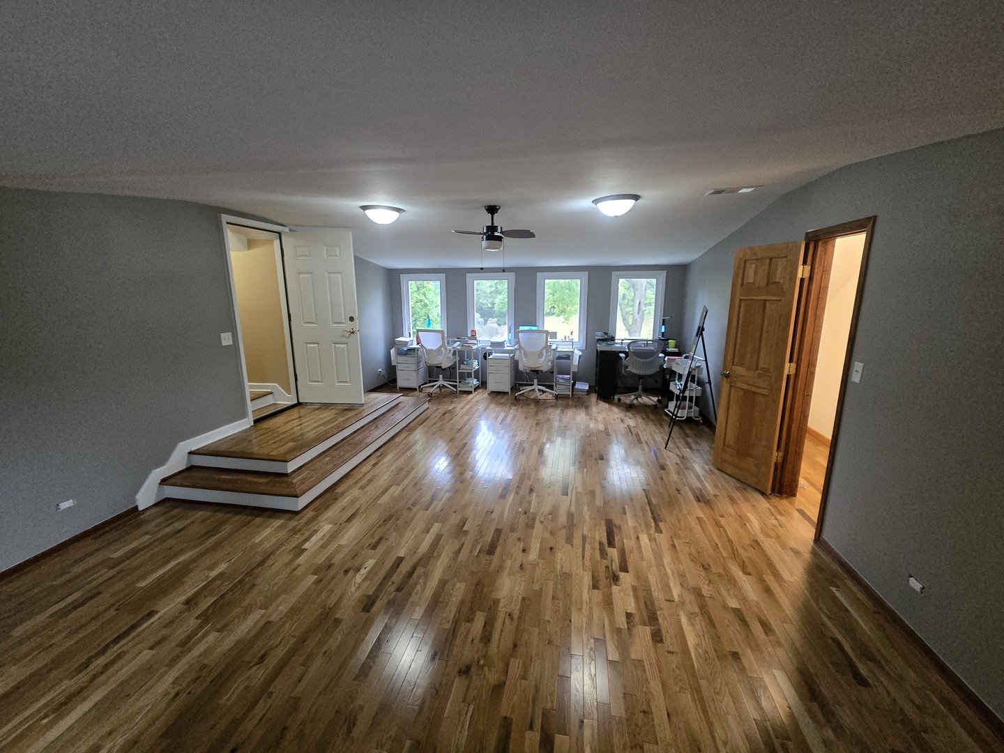 25W201 Summit Drive Naperville, IL 60563 - Photo 31 of 40 a living room with furniture and a wooden floor