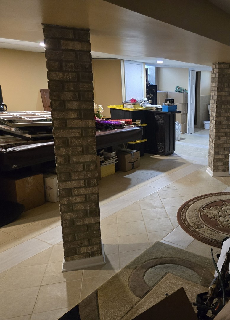 25W201 Summit Drive Naperville, IL 60563 - Photo 35 of 40 a living room with furniture and a fireplace