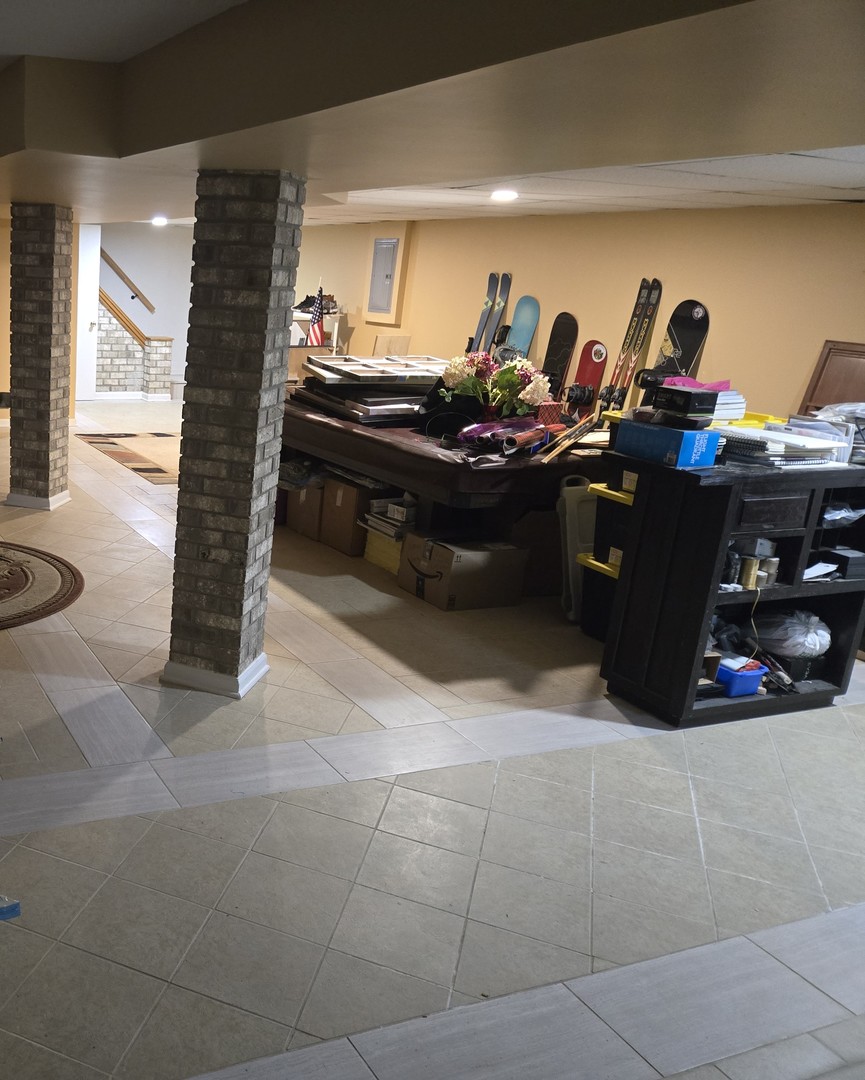 25W201 Summit Drive Naperville, IL 60563 - Photo 36 of 40 a couple of people sitting in a room