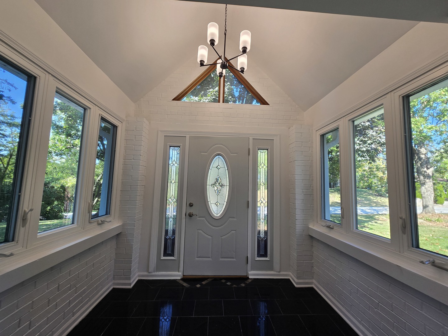 25W201 Summit Drive Naperville, IL 60563 - Photo 6 of 40 a front view of a house with garden