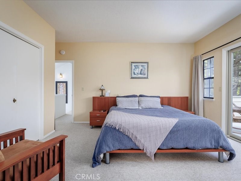 1912 Chester Lane Cambria, CA 93428 - Photo 18 of 41 a bedroom with a bed and window