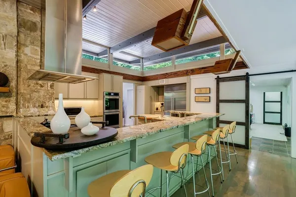 a dining room with table and chairs