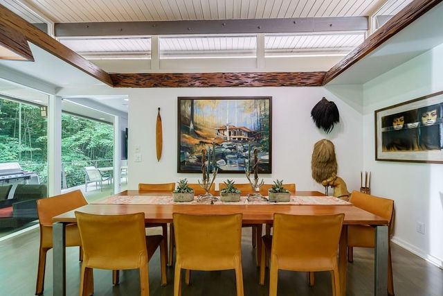 a bedroom with furniture and a large window