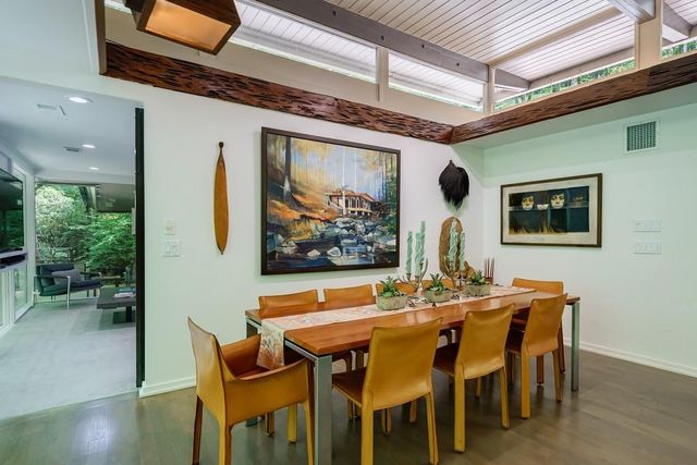 a bathroom with a double vanity sink mirror and shower