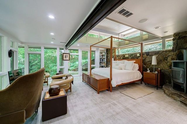 a bedroom with furniture and a bed