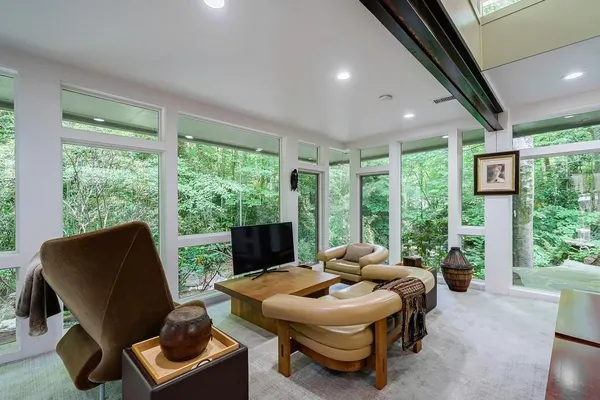 a living room with furniture and a large window