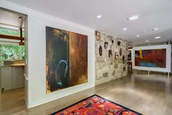 a kitchen with stainless steel appliances granite countertop a stove a microwave and a refrigerator