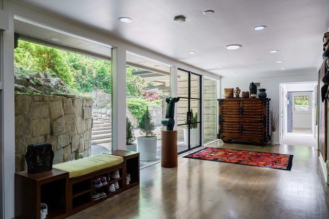 a kitchen with a sink and large window
