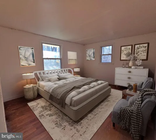 a bedroom with bed and a window