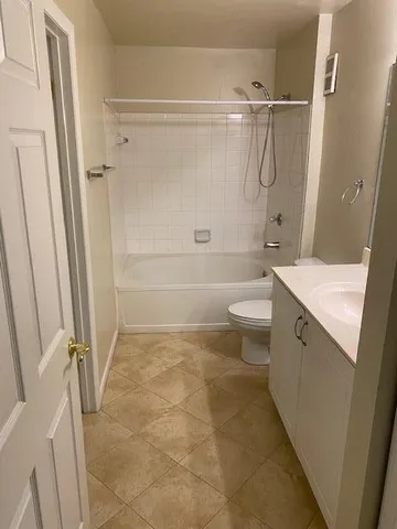 a bathroom with a sink a toilet and a shower
