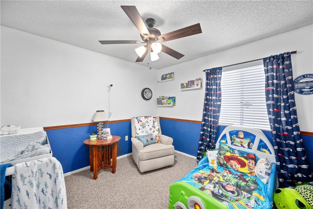 352 Red Spruce Place Perris, CA 92570 - Photo 16 of 30 a living room with furniture and a window