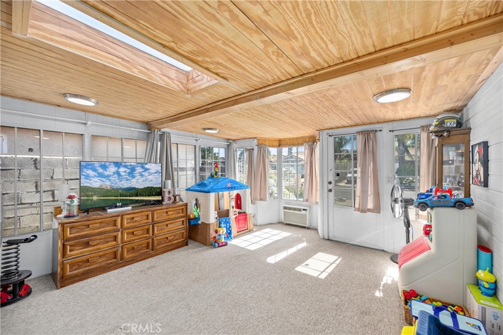 352 Red Spruce Place Perris, CA 92570 - Photo 17 of 30 a living room with furniture and a flat screen tv