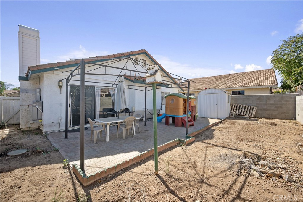 352 Red Spruce Place Perris, CA 92570 - Photo 21 of 30 a view of a house with backyard