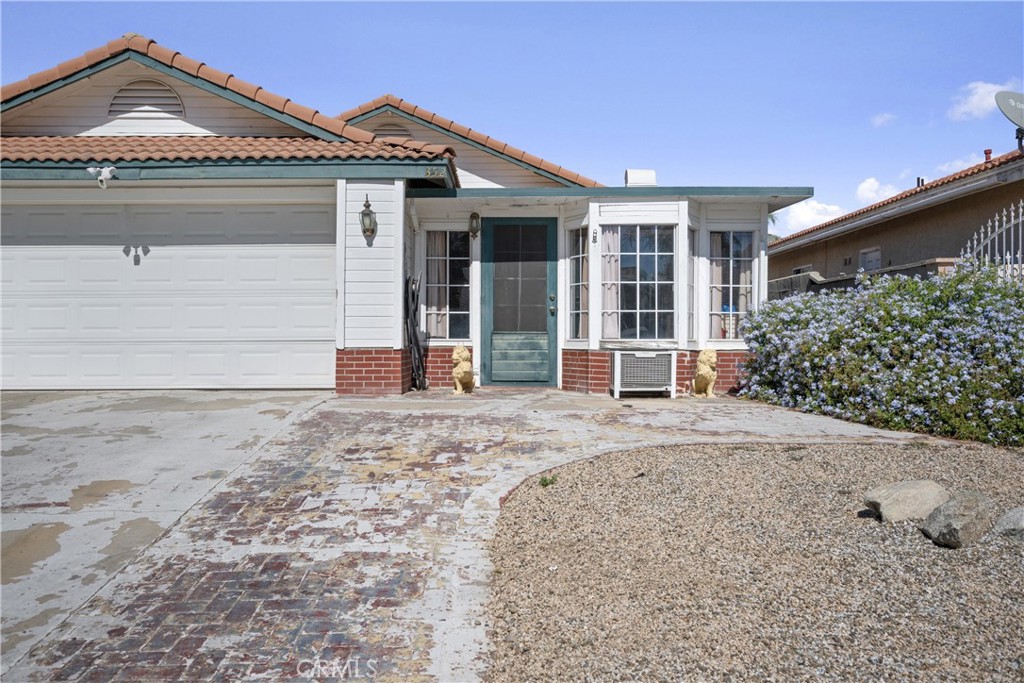 352 Red Spruce Place Perris, CA 92570 - Photo 22 of 30 a view of a house with a yard and garage
